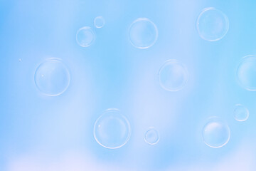Delicate soft blue liquid bubbles on glass. ethereal and dreamy quality makes it perfect for backgrounds and artistic designs. Macro cool photo