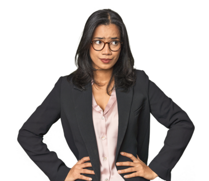 Young Latina professional in studio confused, feels doubtful and unsure.