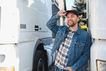 Portrait of confident truck driver on parking lot. Copy space