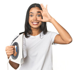 Latina with iron, studio setup keeping eyes opened to find a success opportunity.