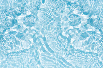 Blue water with ripples on the surface. Defocus blurred transparent blue colored clear calm water surface texture with splashes and bubbles. Water waves with shining pattern texture background.