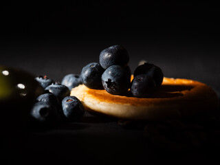 Ripe Blueberries on pancakes fruit macro close up