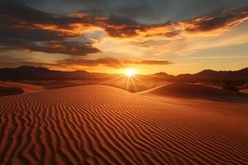 Vibrant sunset over undulating sand dunes in a desert landscape