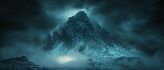 Fototapeta premium Majestic mountain peak shrouded in mist under a dramatic sky evoking a sense of awe and mystery with a cinematic style