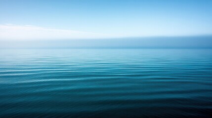 Obraz premium Calm Ocean with Blue Sky, and Morning Mist.