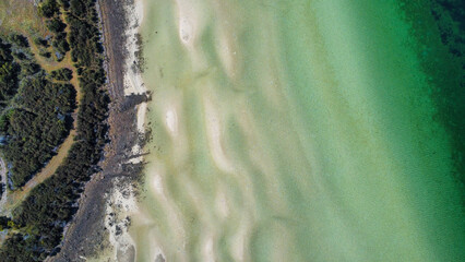 Sandy beach at low tide, seen from above