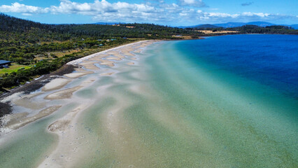Sandy beach at low tide, seen from above