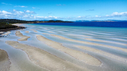 Sandy beach at low tide, seen from above