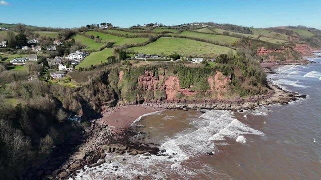Descending aerial view of Maidencombe Beach in Devon