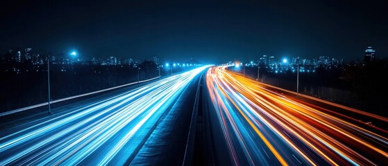 Obraz premium Dynamic highway at night showcasing vibrant light trails with city skyline and street lamps creating a modern urban scene
