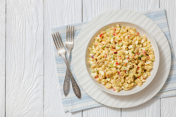 macaroni salad with celery, eggs, red bell pepper