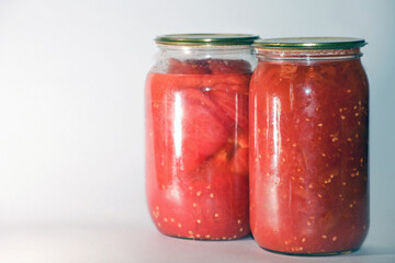 Canned sour tomatoes in glass jars. Pickled tomatoes in a jar.