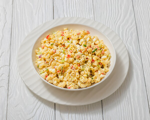 macaroni salad with celery, eggs, red bell pepper