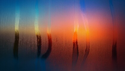 Fototapeta premium Beautiful Sunset Reflected on a Window With Vapor Droplets Creating an Artistic Pattern