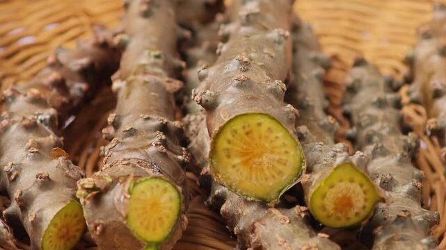 Tinospora cordifolia​​ on wooden table. Zoom in.