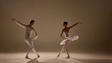 Ballet duet flows together, arms extended, legs poised, every movement controlled yet weightless, captured in glowing light. Concept of rhythm, emotion, beauty, poise, artistic connection, performance © Lustre Art Group 