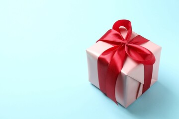 Beautiful gift box on color background