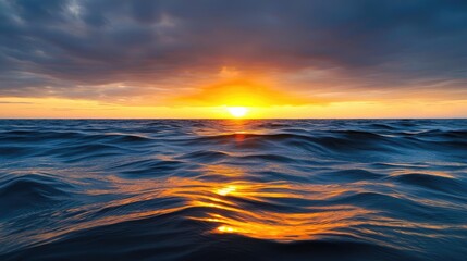 Fototapeta premium Sunset over ocean landscapes idea. Stunning sunset over ocean waves, creating a serene coastal landscape.