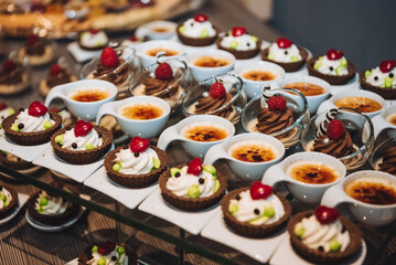 Creme Brulee and other small desserts on the festive table