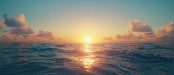 Obraz premium Serene Ocean Sunrise with Soft Clouds and Tranquil Water Reflection
