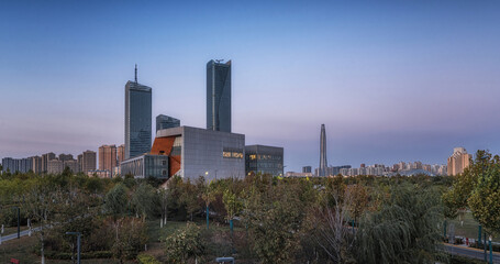 Golden Sunset Over Cityscape with Reflecting Waterfront