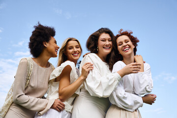 Four stylish women celebrating spring outdoors with confidence and joy in a beautiful park setting