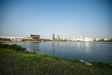 Serene Urban Waterfront View with Modern Architecture and City Skyline