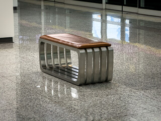 Contemporary Metal and Wood Bench in a Minimalist Environment