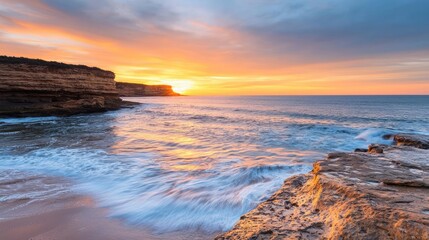 Obraz premium Beach waves landscapes idea. Scenic coastal sunset with waves crashing against rocky cliffs creating a serene atmosphere.
