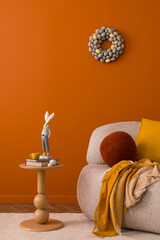 Elegant Easter-themed interior with a cozy sofa, a round side table, and a decorative bunny...