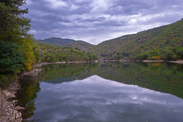 Fototapeta premium Kochani, North Macedonia – 2024.15.09 Lake Gradche in the Evening Glow, Reflecting the Tranquil Twilight Sky