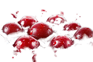 Red liquid droplets splashing on a white surface, vibrant action