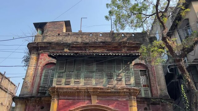 Low angle shot of abandoned haunted Zamindar building in Bengal during daytime.