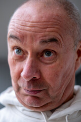 skeptical mature senior man Outdoors, male face shows frustration, skepticism, and emotional pain close-up, Female model expressing frustration and doubt with tense pose