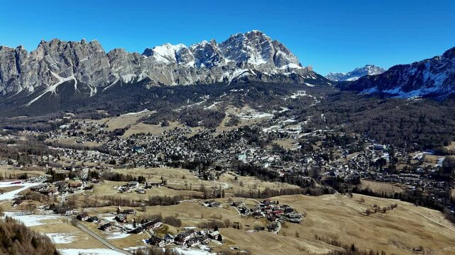 scenic aerial drone footage of Cortina d&rsquo;Ampezzo is a ski resort in northern Italy. It&rsquo;s part of the Dolomiti Superski area