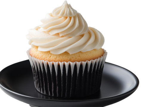 Delicious vanilla cupcake with swirled frosting on a plate