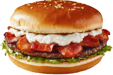 Juicy bacon burger with creamy sauce on fresh lettuce