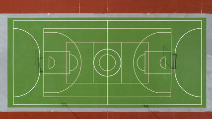 Aerial view of a green and multipurpose playing field. The field is empty.