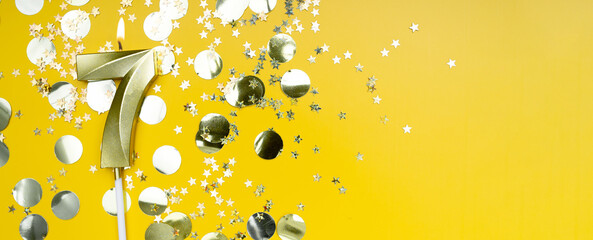 Golden candle number seven on yellow background. Birthday card with lettering 7. Anniversary...