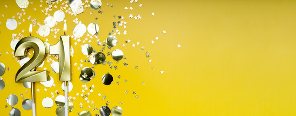 Golden candle number twenty-one on yellow background. Birthday card with lettering 21. Anniversary...