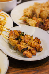 Indonesian satay, captured on March 17, 2025. Grilled skewered meat coated in rich spices and served with savory peanut sauce, creating a flavorful and authentic dish