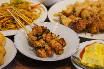 Indonesian satay, captured on March 17, 2025. Grilled skewered meat coated in rich spices and served with savory peanut sauce, creating a flavorful and authentic dish