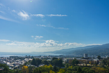 Sagami Bay and town under blue sky and white clouds