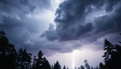 Fototapeta premium Dramatic Thunderstorm Lightning Strikes Over Dark Forest and Ominous Clouds at Night