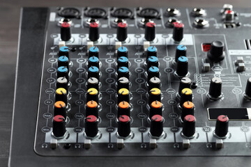 Professional mixing console on table, closeup. Radio studio equipment