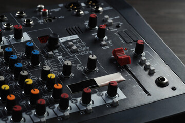 Professional mixing console on table, closeup. Radio studio equipment