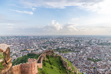 Fototapeta premium A breathtaking view of Jaipur city as seen from Nahargarh Fort, Rajasthan, India, offering a stunning blend of historical charm and urban landscape.