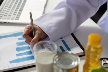 Nutrition Insights and Dietary Management. A healthcare professional analyzing data and suggesting...