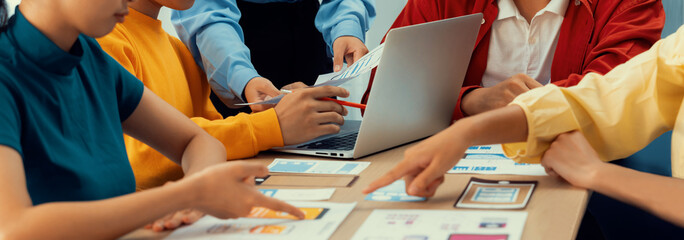 Panorama banner of startup company employee planning on user interface prototype for mobile application or website in office. UX UI designer brainstorm user friendly interface plan. Synergic