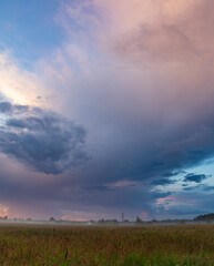Cloudy sky with a few clouds in the distance